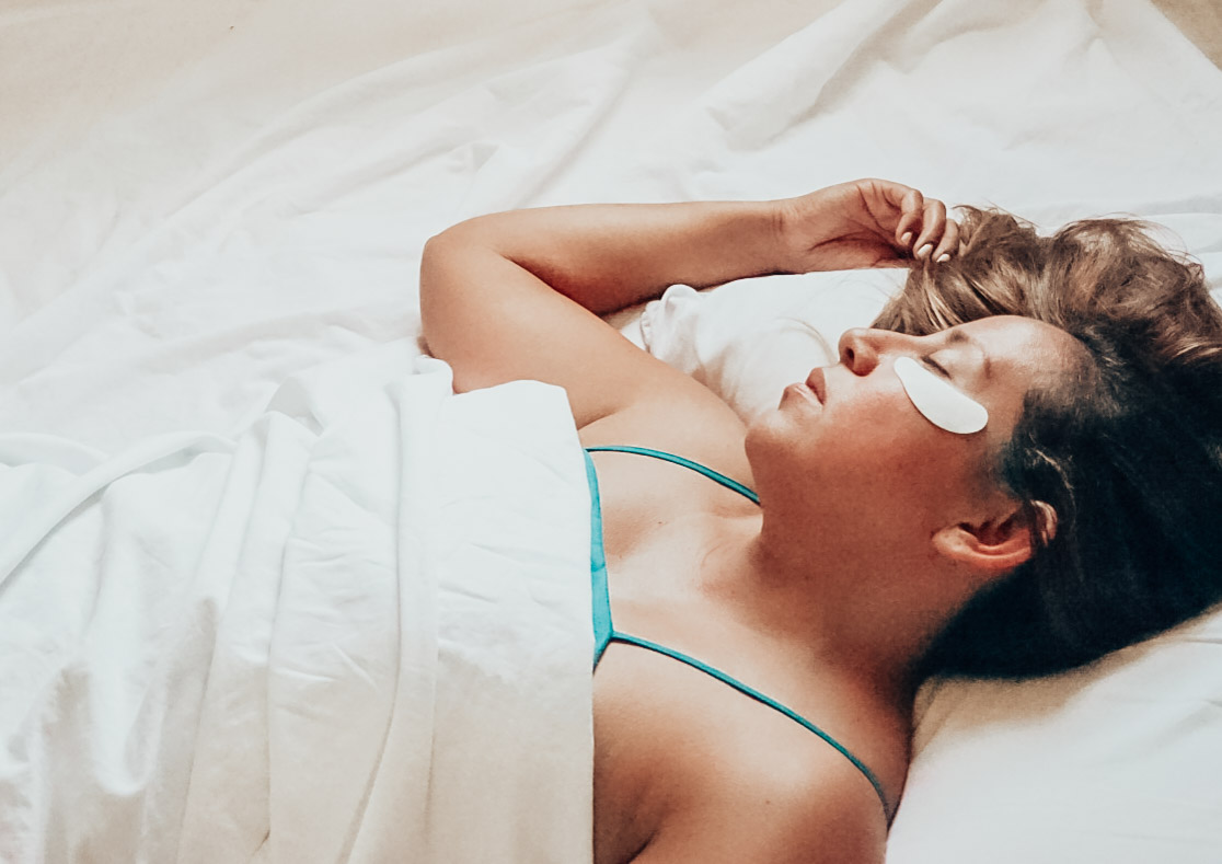 Woman is sleeping with gel eye masks.