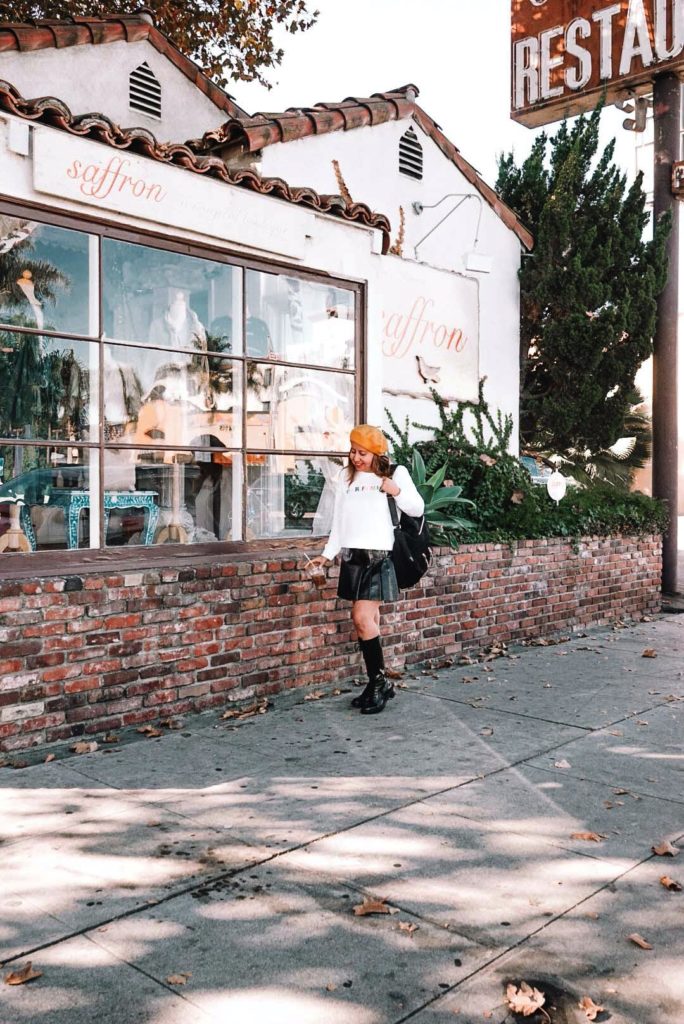 Mini skirt and combat boots style with a Parisian beret.