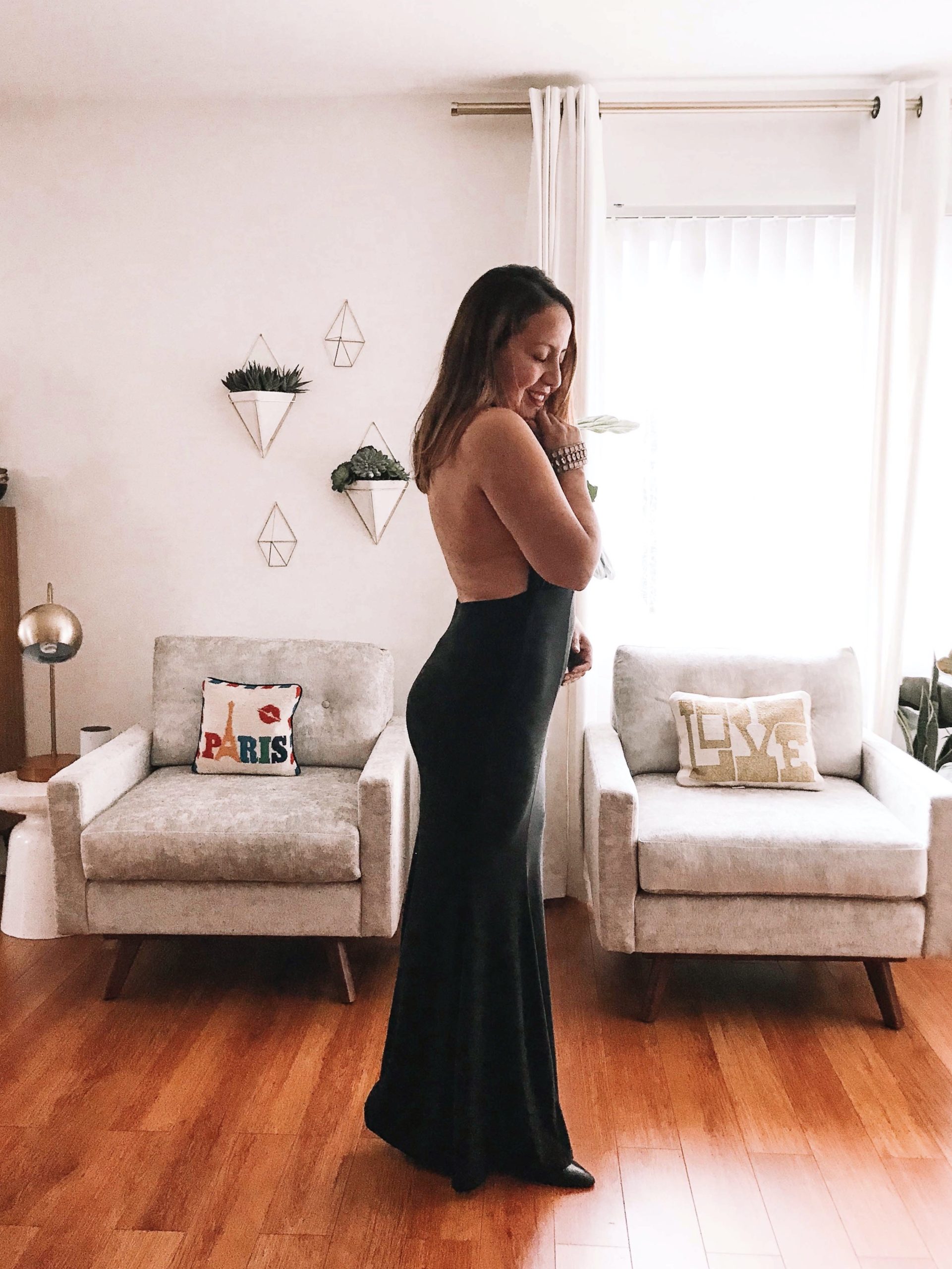 A open back black dress can be sexy and classy at the same time. 